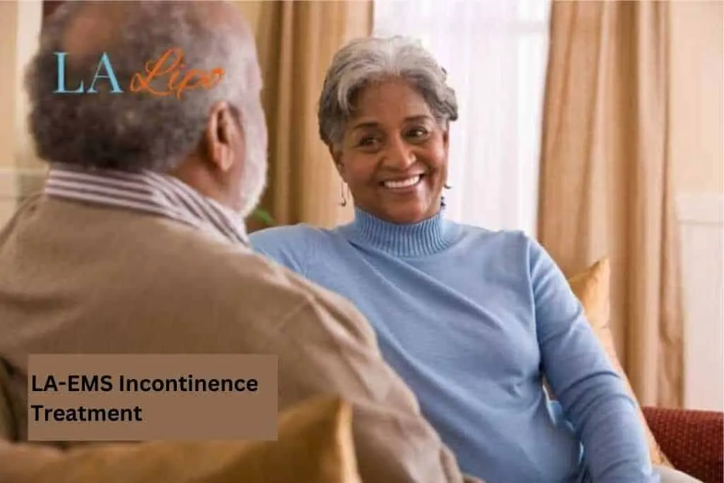Couple sat smiling at each other - LA-EMS treatment Fulham