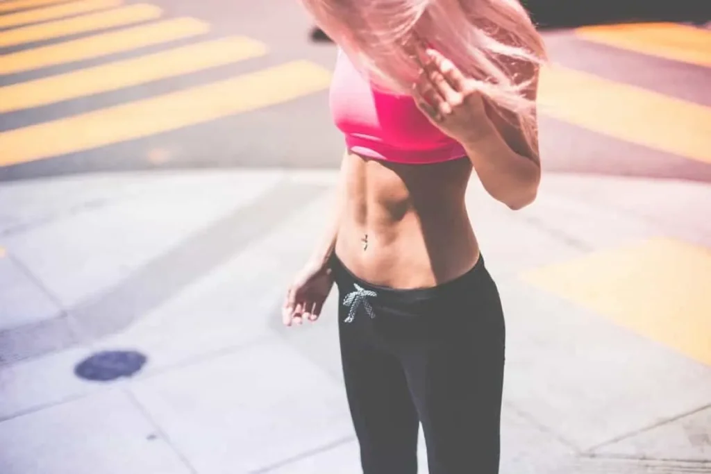 Woman with toned stomach after LA-EMS Body Sculpting Treatment Fulham